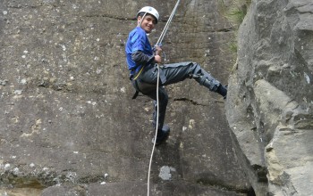 A boy abseiling